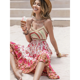 Woman wearing crochet boho maxi dress in floral patterns sitting outdoors with ice cream cone