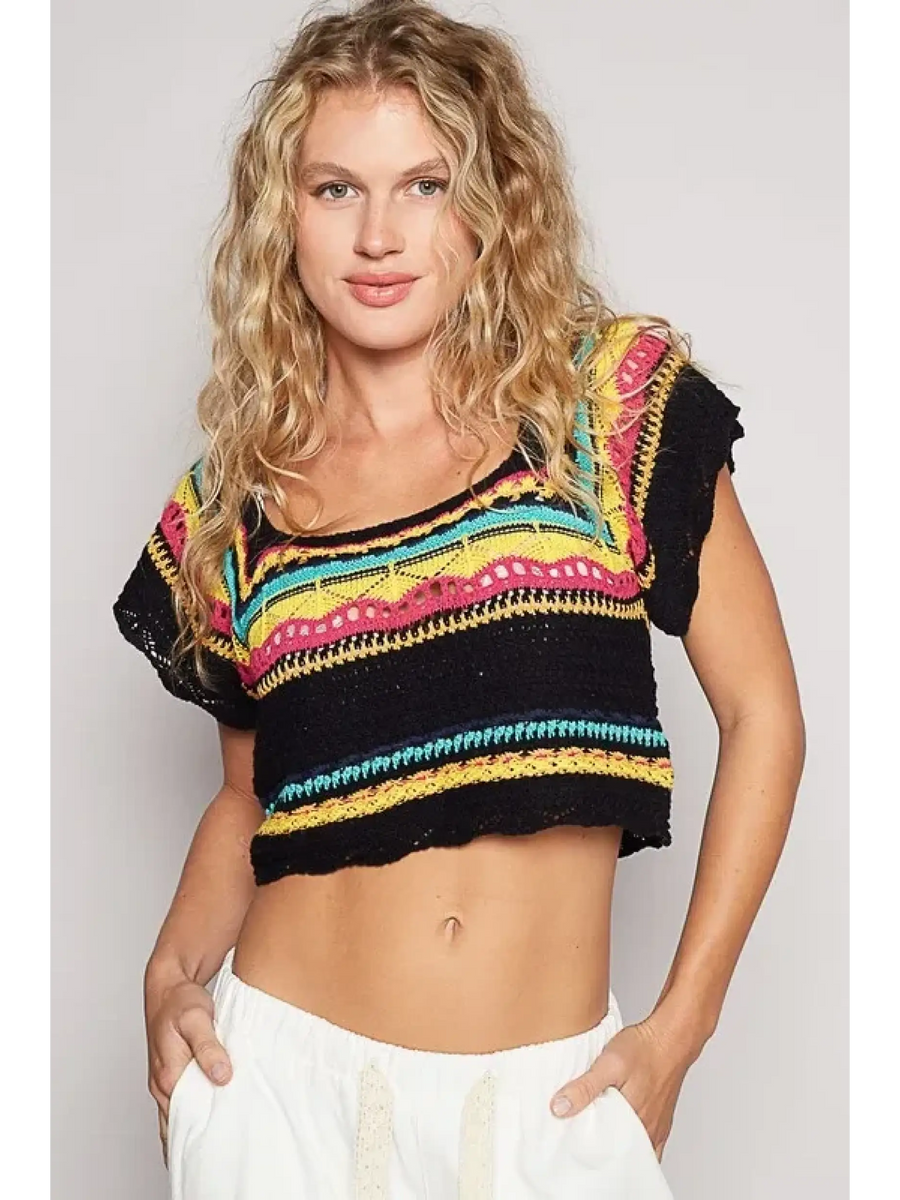 POL boho knit beach top in black multicolor worn by model with white pants
