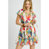 Trendsi orange boho mini dress with colorful leaf print and flutter sleeves on smiling model