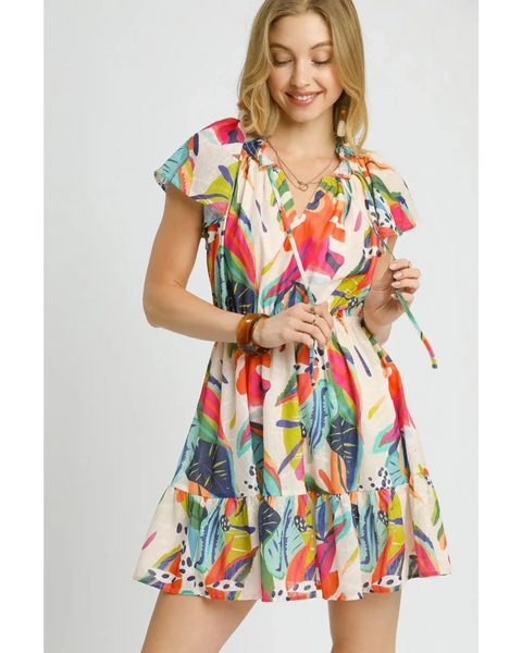 Trendsi orange boho mini dress with colorful leaf print and flutter sleeves on smiling model