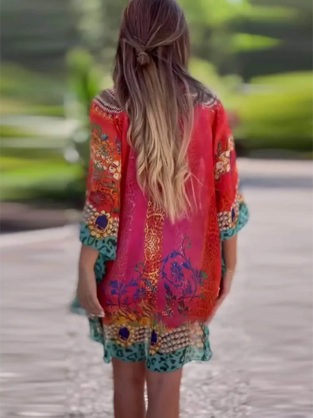 Babe Beachwear boho mini swimsuit coverup with colorful floral and geometric patterns worn by a woman