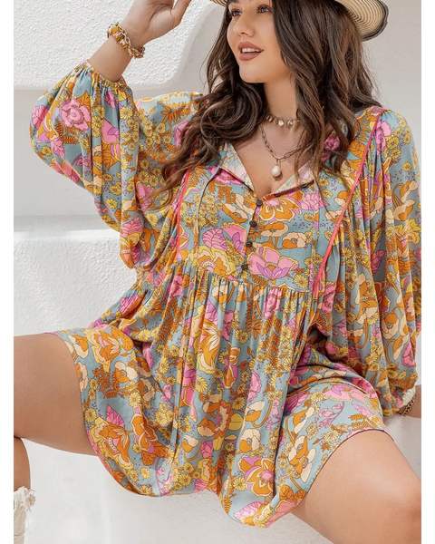 Babe Beachwear plus size floral romper with colorful pattern and long sleeves