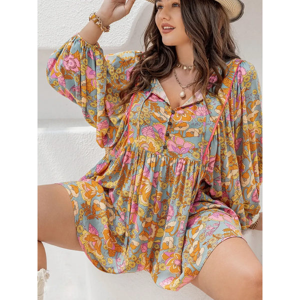 Babe Beachwear plus size floral romper with colorful pattern and long sleeves