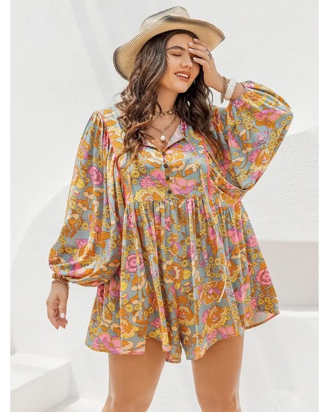Plus size floral romper by Babe Beachwear with long balloon sleeves and a colorful floral print
