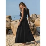 Babe Beachwear black maxi dress worn by woman on beach showcasing boho summer white crochet dress style inspiration