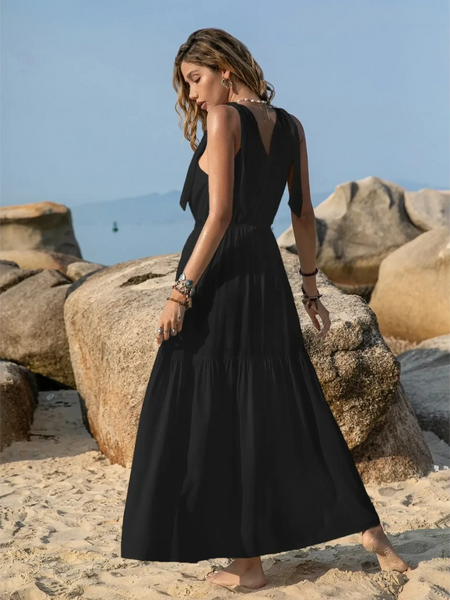 Babe Beachwear black maxi dress worn by woman on beach showcasing boho summer white crochet dress style inspiration