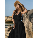 Babe Beachwear black maxi dress with sleeveless design and summer beach setting