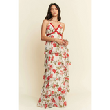 Trendsi boho tiered maxi dress with floral print and red trim on a model