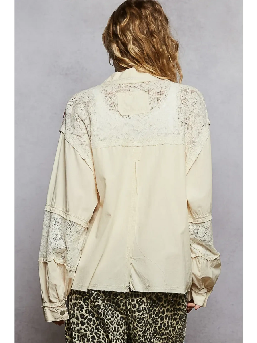 Back view of boho vacation jacket with lace trim in cream from Trendsi worn with leopard print pants