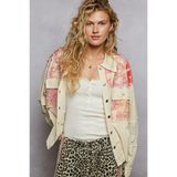 Babe Beachwear boho vacation jacket with lace trim in cream with colorful patchwork worn by model