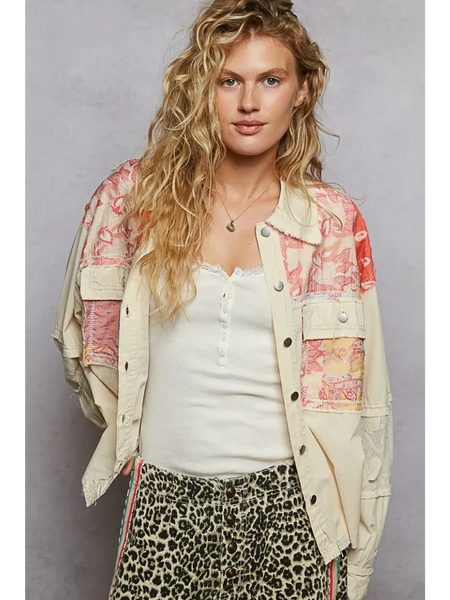 Babe Beachwear boho vacation jacket with lace trim in cream with colorful patchwork worn by model
