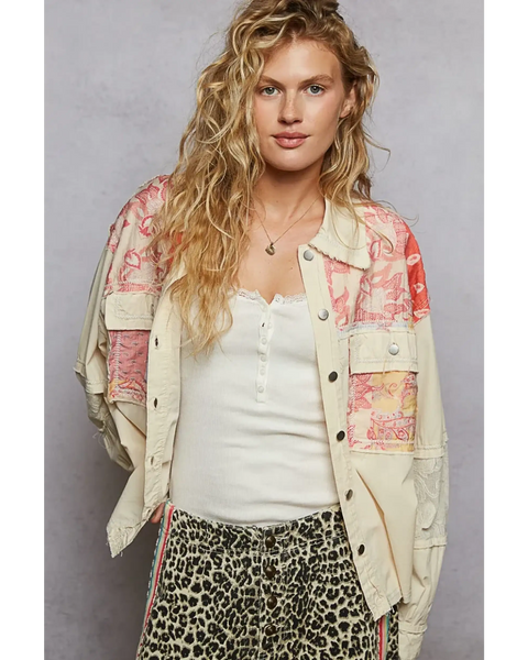Babe Beachwear boho vacation jacket with lace trim in cream with colorful patchwork worn by model