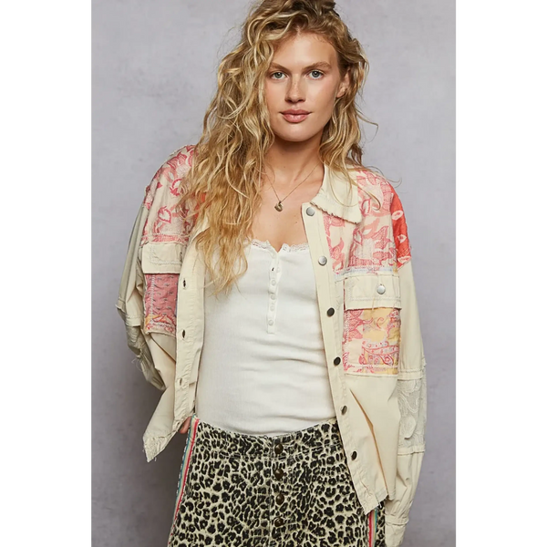 Babe Beachwear boho vacation jacket with lace trim in cream with colorful patchwork worn by model