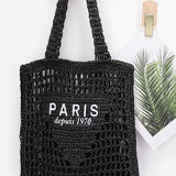 Black Paris Crochet Straw Summer Tote bag by Babe Beachwaer with open weave design and Paris logo