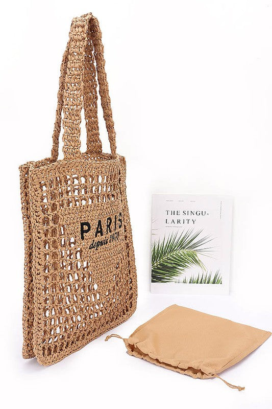 Paris Crochet Straw Summer Tote by Babe Beachwear with open weave design and black printed text
