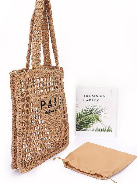 Paris Crochet Straw Summer Tote by Babe Beachwear with open weave design and black printed text