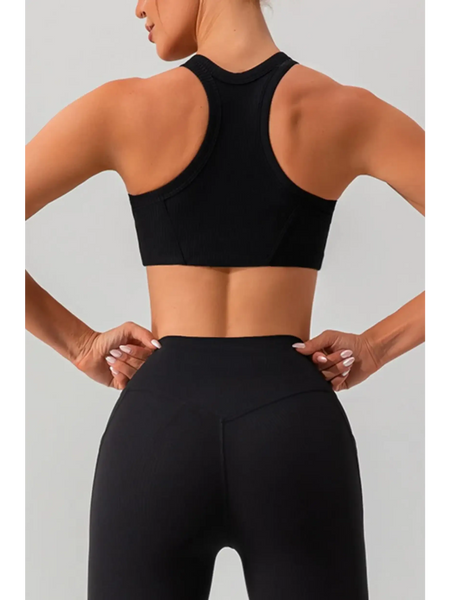 Back view of a woman wearing Babe Beachwear women's racerback active tank in black
