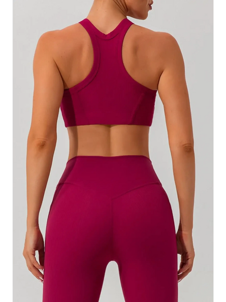 Babe Beachwear women's racerback active tank in deep magenta shown from the back with matching high-waisted leggings
