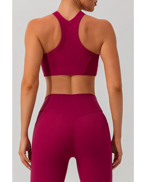 Babe Beachwear women's racerback active tank in deep magenta shown from the back with matching high-waisted leggings