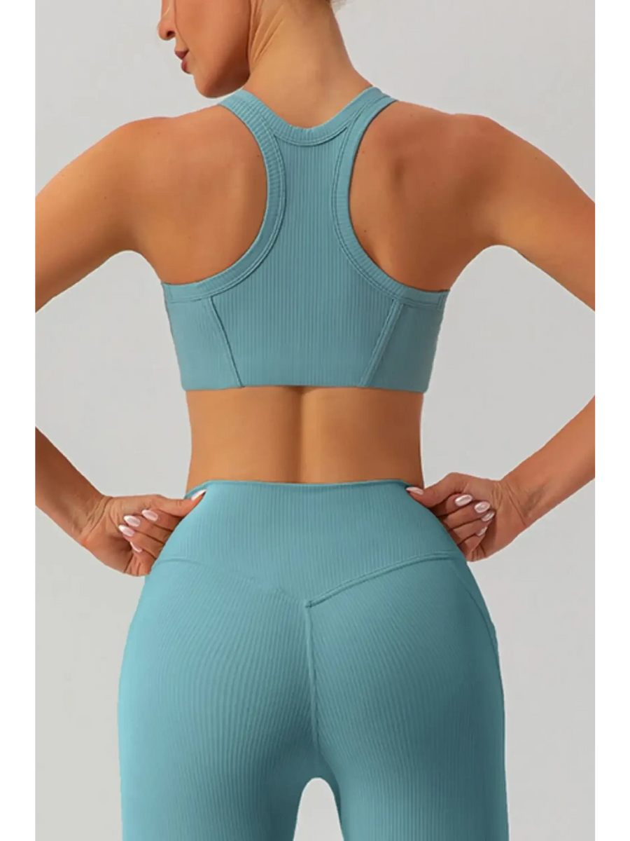 Babe Beachwear women's racerback active tank in light blue ribbed fabric shown from back