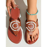 Babe Beachwear brown pearl embellished sandals with circular pearl design worn on foot with turquoise anklet