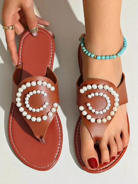 Babe Beachwear brown pearl embellished sandals with circular pearl design worn on foot with turquoise anklet