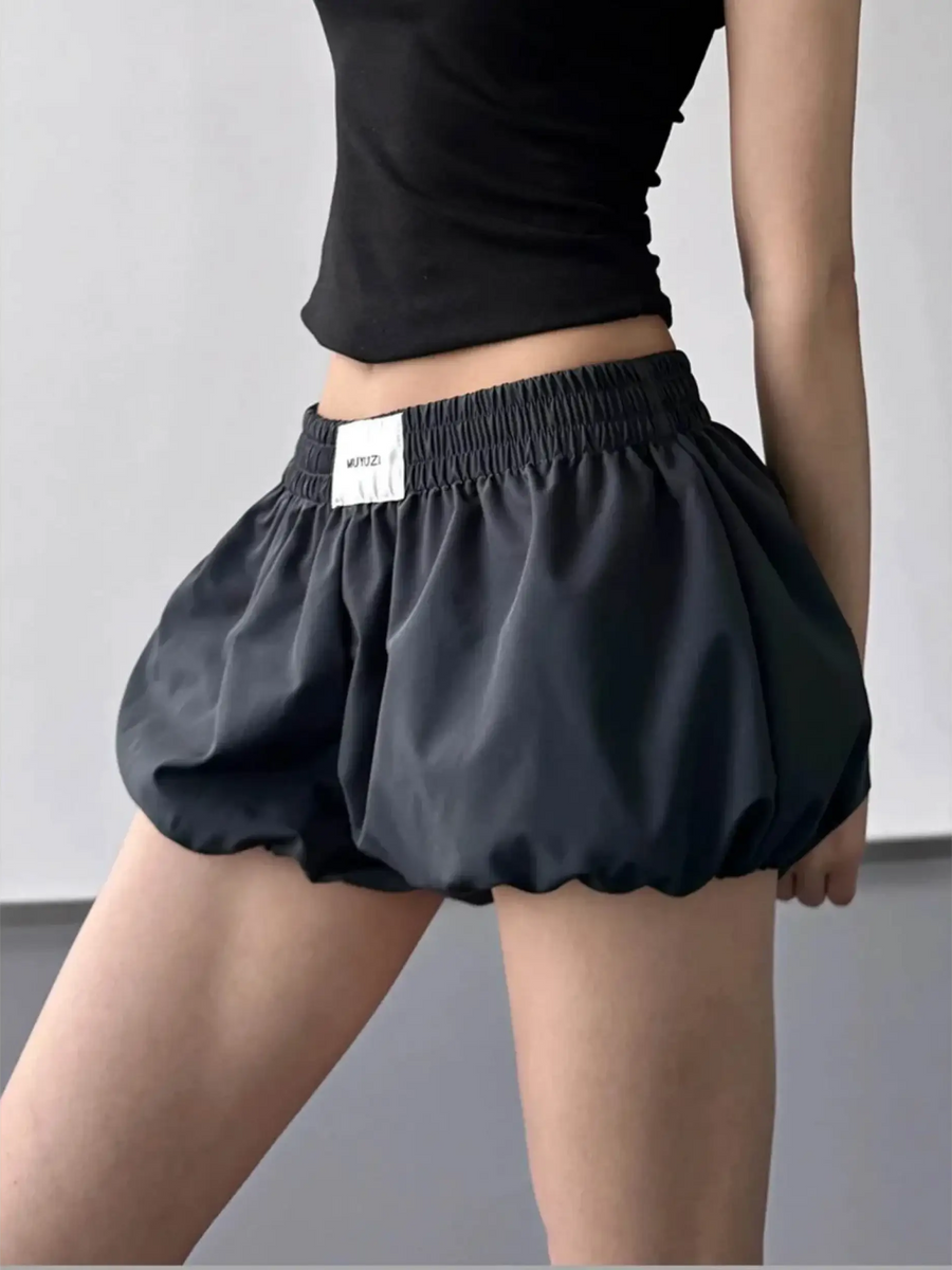 Babe Beachwear casual black Bubble Shorts-Summer 2025 with elastic waistband worn with a black top