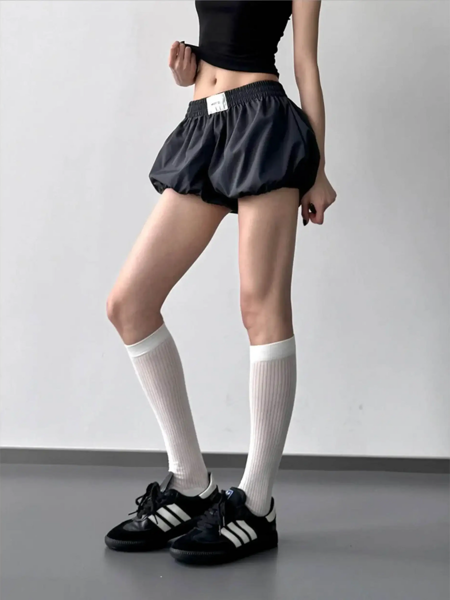 Babe Beachwear Bubble Shorts-Summer 2025 in black casual puffed design worn with white knee socks and black sneakers