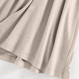 Close-up of beige fabric showing soft texture of the Built-In Bra Shelf Midi Dress by Trendsi