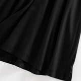Close-up of black fabric and hem detail of Trendsi Built-In Bra Shelf Midi Dress