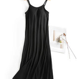 Trendsi black Built-In Bra Shelf Midi Dress with spaghetti straps hanging on a wooden hanger