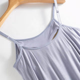 Trendsi light purple Built-In Bra Shelf Midi Dress with adjustable straps hanging on wooden hanger