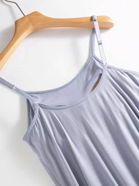 Trendsi light purple Built-In Bra Shelf Midi Dress with adjustable straps hanging on wooden hanger