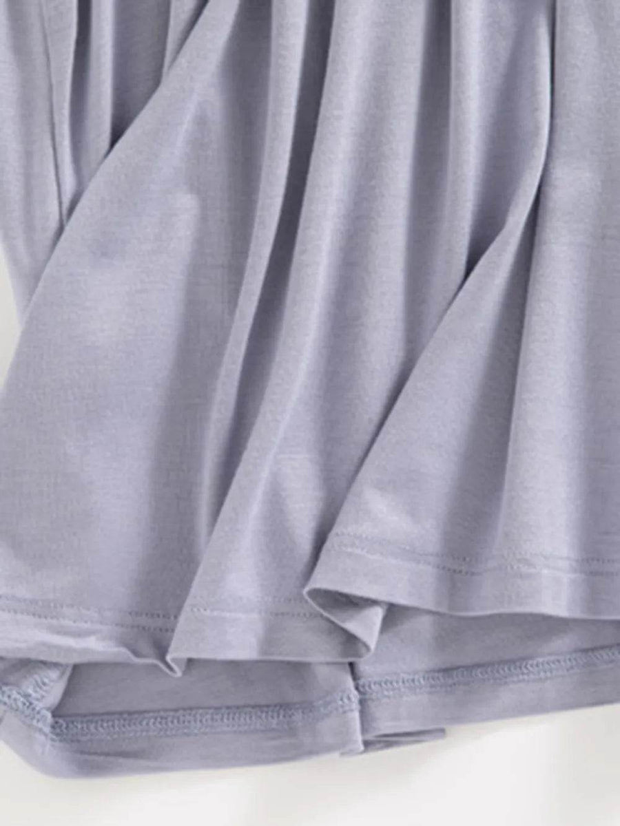 Close-up of soft lavender fabric detail of Trendsi Built-In Bra Shelf Midi Dress hem and stitching