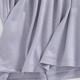 Close-up of soft lavender fabric detail of Trendsi Built-In Bra Shelf Midi Dress hem and stitching