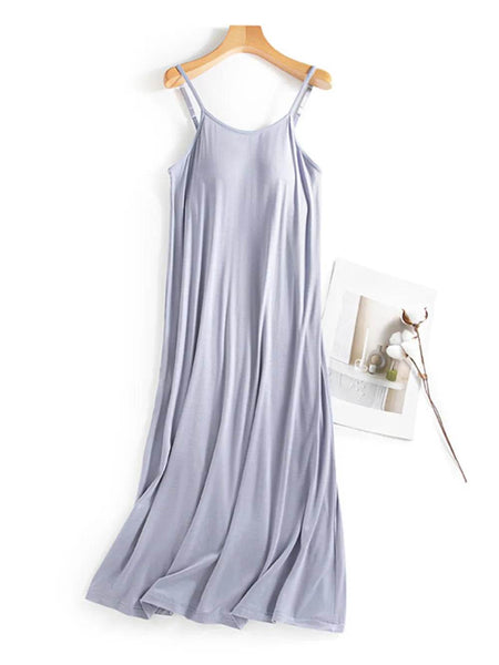 Trendsi light purple Built-In Bra Shelf Midi Dress with spaghetti straps hanging on wooden hanger