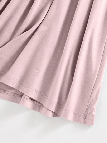 Close-up of soft pink fabric detailing the hem of the Trendsi Built-In Bra Shelf Midi Dress