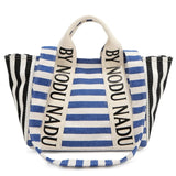 Chic summer tote for women by Babe Beachwaer featuring blue and black striped design with bold text handles