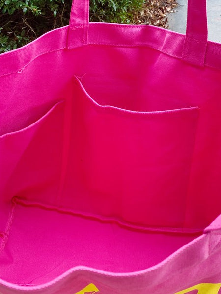 Bright pink Babe Beachwear canvas beach tote bag interior showing large open compartments