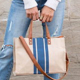Babe Beachwear Canvas Stripe Tote for 2025 Summer Resort Wear with blue stripes and brown leather handles