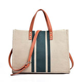 Babe Beachwear Canvas Stripe Tote for 2025 Summer Resort Wear with brown leather handles and blue striped design
