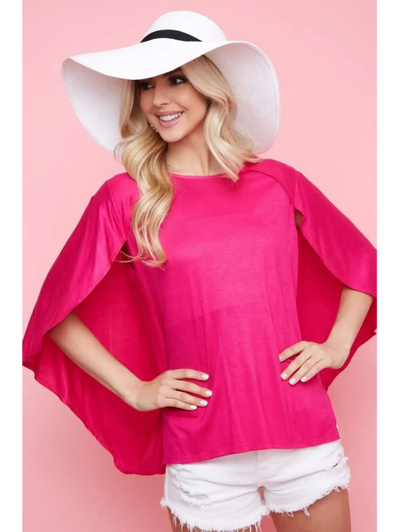 Trendsi pink short sleeve Cape Style Shirt with flowing cape sleeves worn with white shorts and a white hat