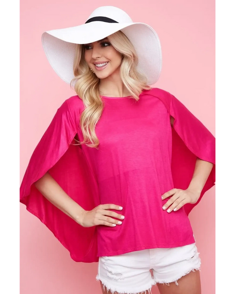 Trendsi pink short sleeve Cape Style Shirt with flowing cape sleeves worn with white shorts and a white hat