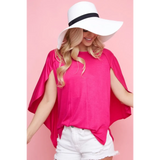 Trendsi bright pink short sleeve Cape Style Shirt with flowing cape design worn with white shorts and a wide brim hat