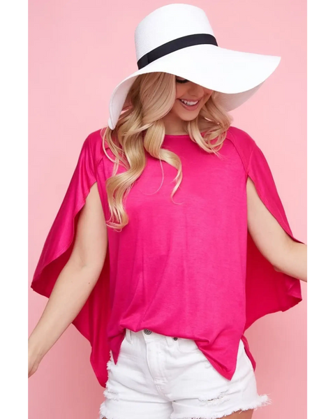 Trendsi bright pink short sleeve Cape Style Shirt with flowing cape design worn with white shorts and a wide brim hat