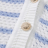 Close-up of EG fashion casual beachwear knit top with gold decorative buttons on white and blue sleeveless shirt