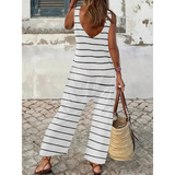 casual chic striped jumpsuit in white with black horizontal stripes, sleeveless with low back design