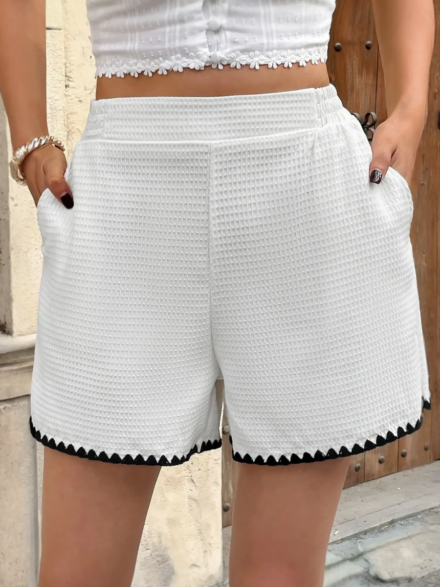 White waffle-textured shorts with black trim for curvy queens, perfect for summer vibe