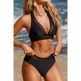 Beach Babes black swimsuit with cheeky bikini bottoms sporty top and mesh detail at the beach