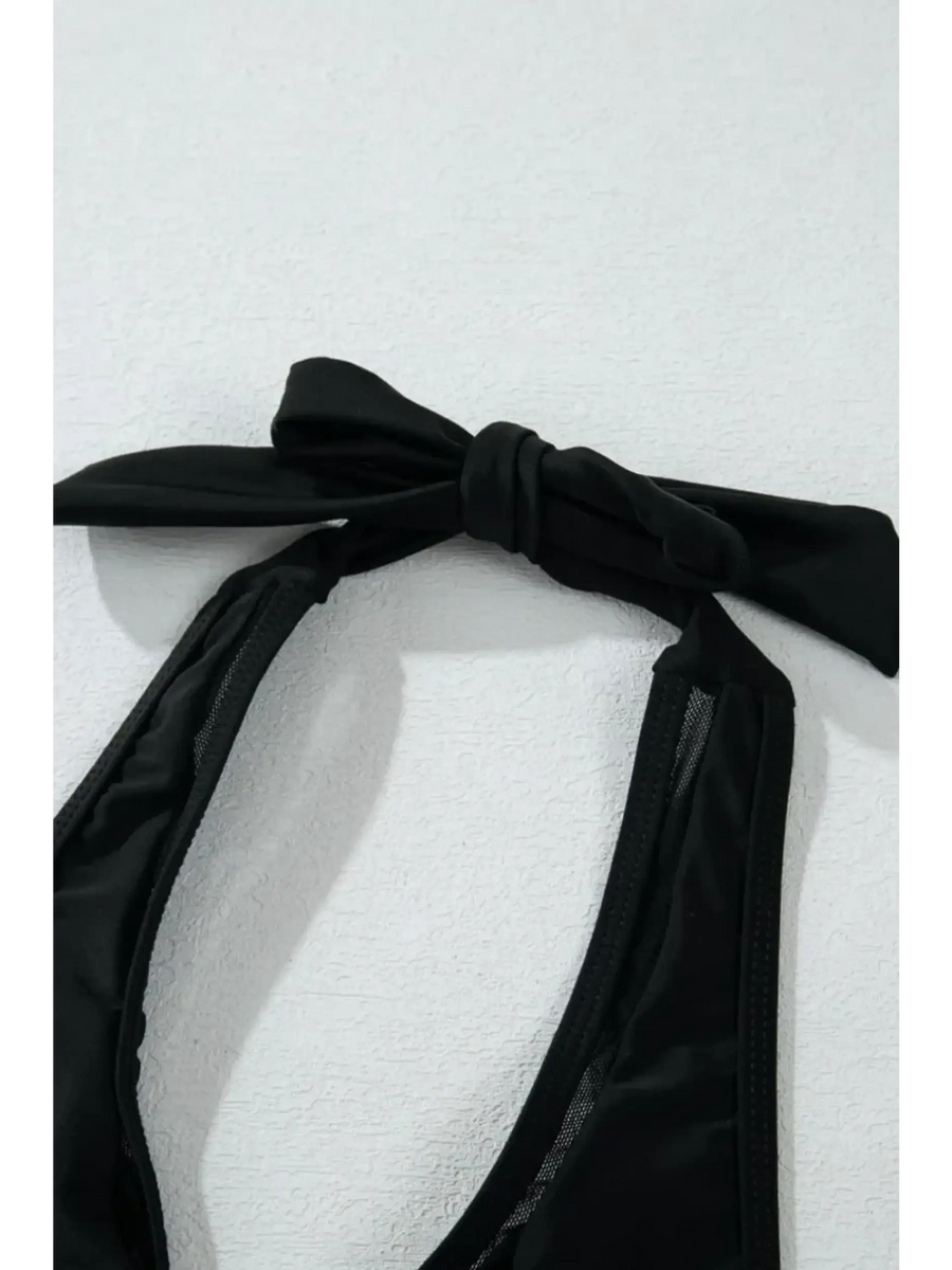 Black cheeky bikini bottoms sporty top by Beach Babes with tied halter neck design on white background